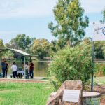 Group of people having morning tea at Roma Bush Gardens